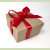 Red Bow on Brown Kraft Gift Box